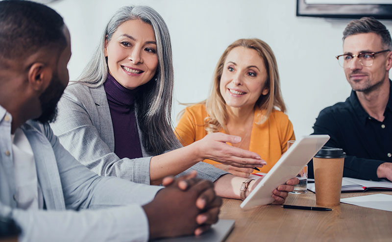 Advisors meeting with a client in a modern office